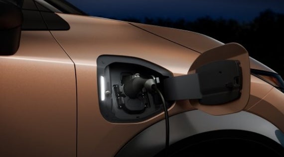 Close-up image of charging cable plugged in | Bedford Nissan in Bedford OH
