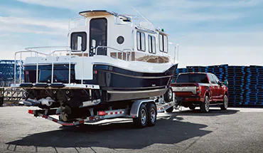 2022 Nissan TITAN Truck towing boat | Bedford Nissan in Bedford OH