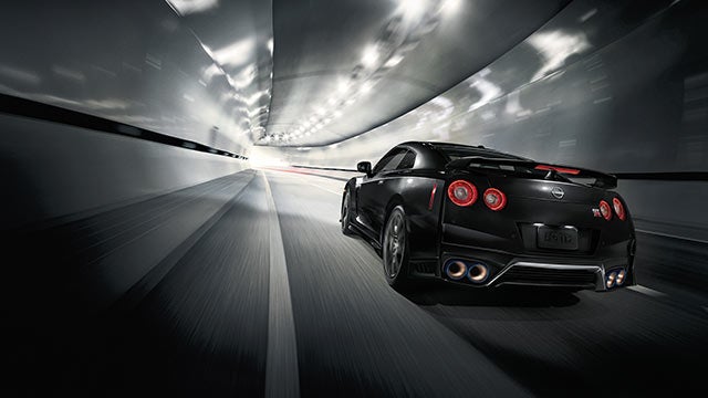 2023 Nissan GT-R seen from behind driving through a tunnel | Bedford Nissan in Bedford OH